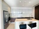 Modern kitchen with island and bar stools