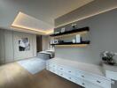 modern bedroom with recessed lighting and built-in shelves