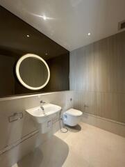 Modern bathroom with floating sink and wall-mounted toilet