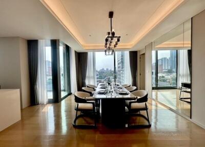 Modern dining area with large windows and city view