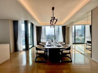 Modern dining area with large windows and city view