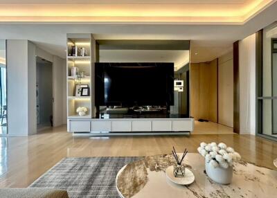 Modern living room with large TV and decorative elements