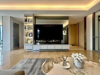 Modern living room with large TV and decorative elements