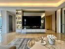 Modern living room with large TV and decorative elements