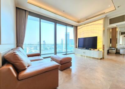 Modern living room with city view and large TV