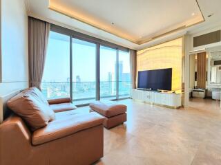 Modern living room with city view and large TV