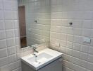 Modern bathroom with sleek vanity and large mirror