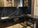 Modern kitchen with black marble countertops and sleek cabinetry