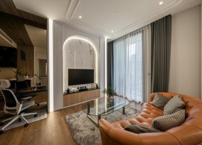 Modern living room with leather sofa and glass coffee table