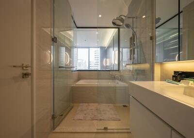 Modern bathroom with glass shower and bathtub