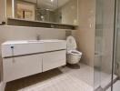 Modern bathroom with glass shower and vanity