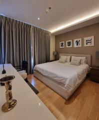 Spacious bedroom with large bed and modern decor