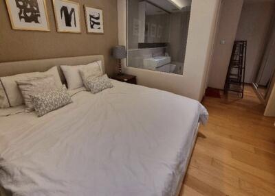 Spacious bedroom with large bed and ensuite bathroom