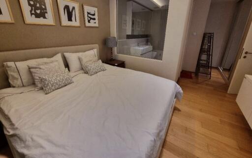 Spacious bedroom with large bed and ensuite bathroom