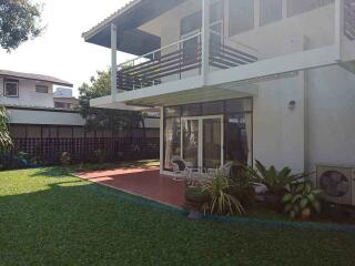 Modern two-story house with patio and garden