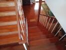 Wooden staircase with white railings