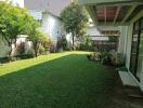 Beautiful well-maintained garden with lush green lawn