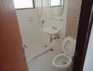 Bathroom with shower, toilet and sink