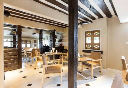 Cozy dining area with wooden beams and modern furniture