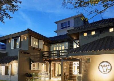 Front view of a modern house exterior at dusk