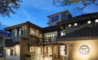 Front view of a modern house exterior at dusk