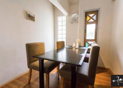 cozy dining area with table and chairs