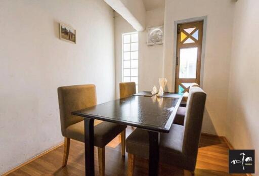 cozy dining area with table and chairs