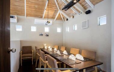 Cozy dining room with seating and air conditioning