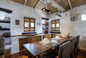 Dining room with a table set for guests