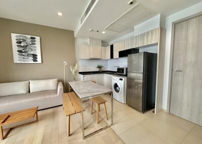 Modern kitchen and living area with appliances