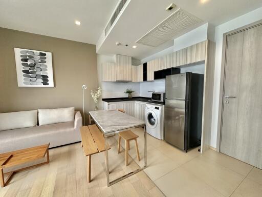 Modern kitchen and living area with appliances