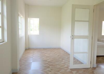 Spacious bedroom with large windows