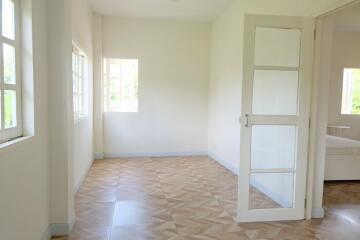 Spacious bedroom with large windows