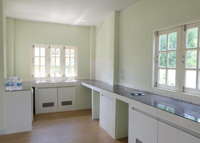 Bright kitchen with large windows and modern fixtures