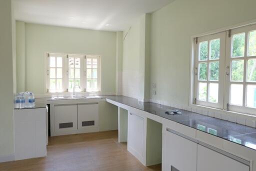 Bright kitchen with large windows and modern fixtures