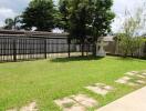 Backyard garden with a lawn and trees