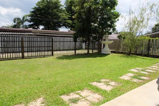 Backyard garden with a lawn and trees