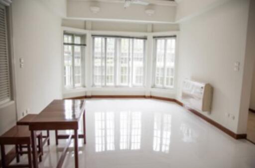 Bright living room with large windows and minimalist furniture