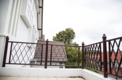 Balcony with railing and view of neighboring houses