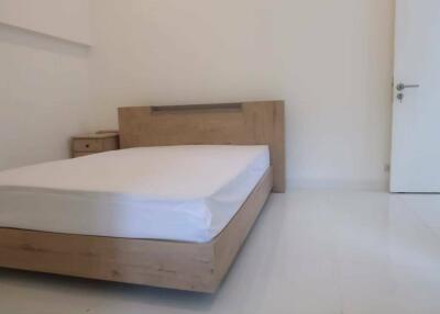 Simple and minimalist bedroom with wooden bed frame