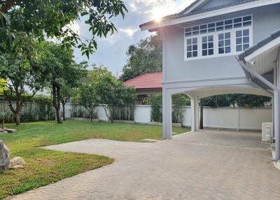 Spacious outdoor area with garden and driveway