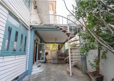 Outdoor patio with a staircase and seating area