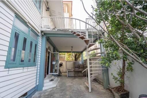 Outdoor patio with a staircase and seating area