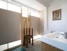 Modern bathroom with natural lighting and wooden accents.