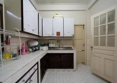 A functional kitchen with white cabinetry and countertops