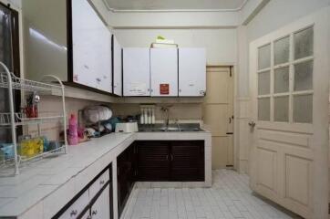 A functional kitchen with white cabinetry and countertops