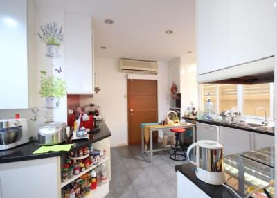 Modern kitchen with various appliances and storage