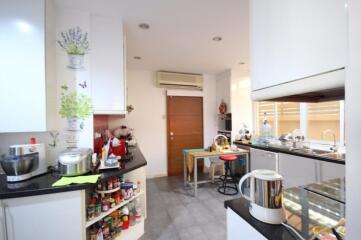 Modern kitchen with various appliances and storage