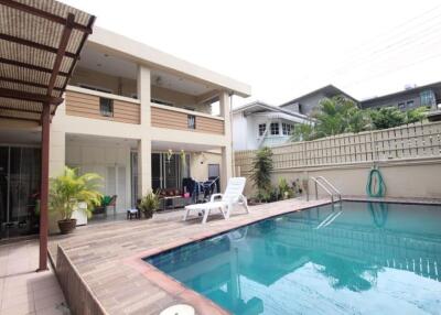 Outdoor area with swimming pool and seating space