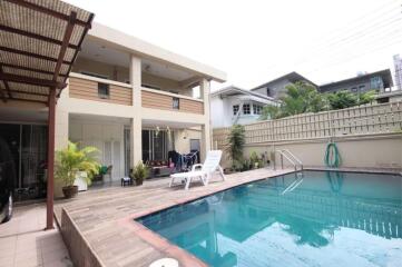 Outdoor area with swimming pool and seating space